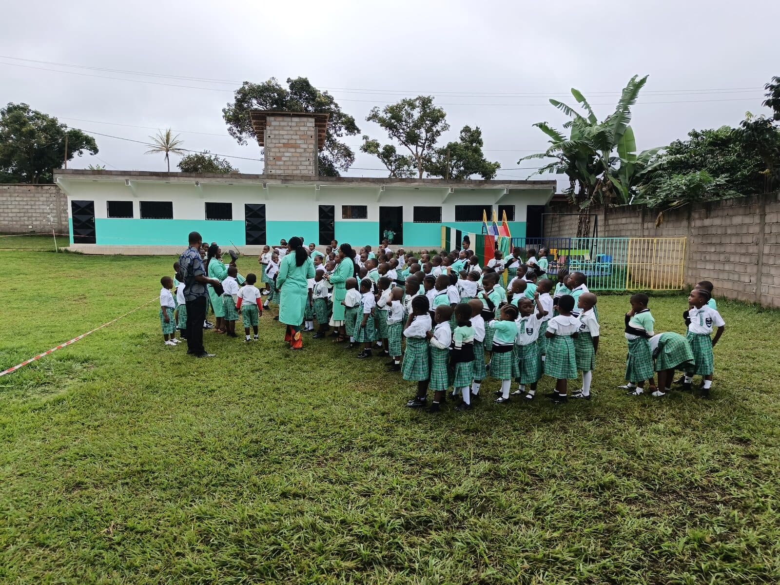 children on the lawn at morning assembly